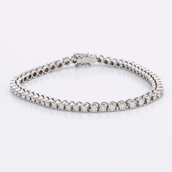 TENNISARMBAND 18K vitguld m 54 briljanter ca 3 ct.