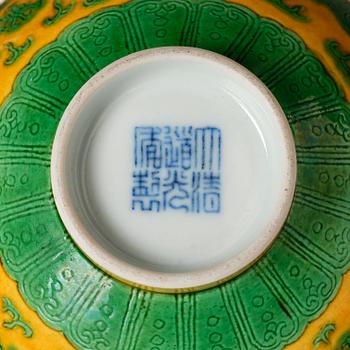 A yellow-ground green-enamelled 'dragon' and phoenix bowl, underglaze blue Daoguang seal mark and of the period.