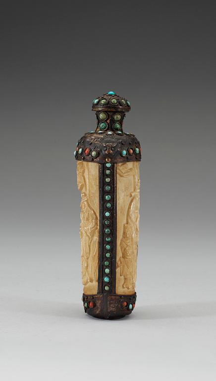 A turquoise inlayed metal framed ivory flask, late Qing dynasty (1644-1911).