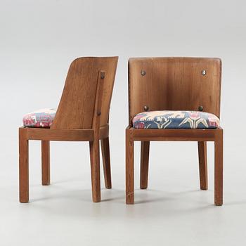 A pair of Axel Einar Hjorth 'Lovö' stained pine armchairs, Nordiska Kompaniet, Sweden 1930's.