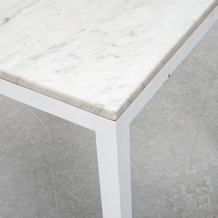 A marble top table, 21th century.