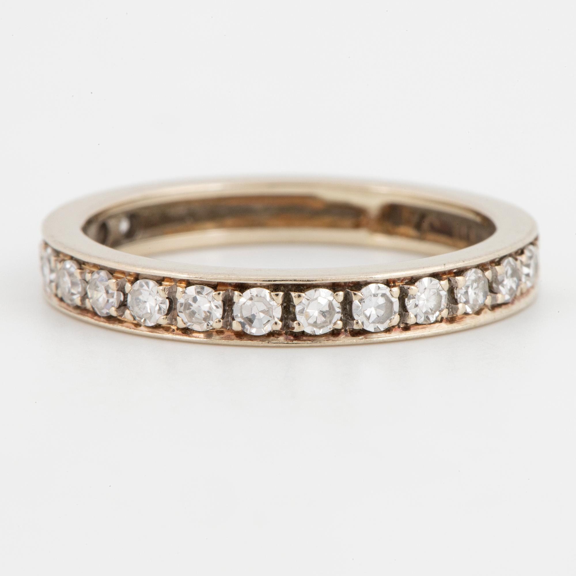 Half-eternity white gold with eight-cut diamond ring.