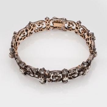 A BRACELET set with old- and rose-cut diamonds.