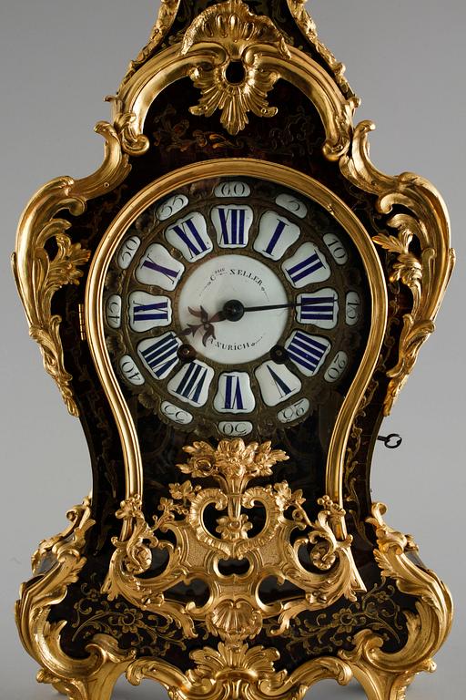 A 19th century mantle clock in the style of Louis XV.