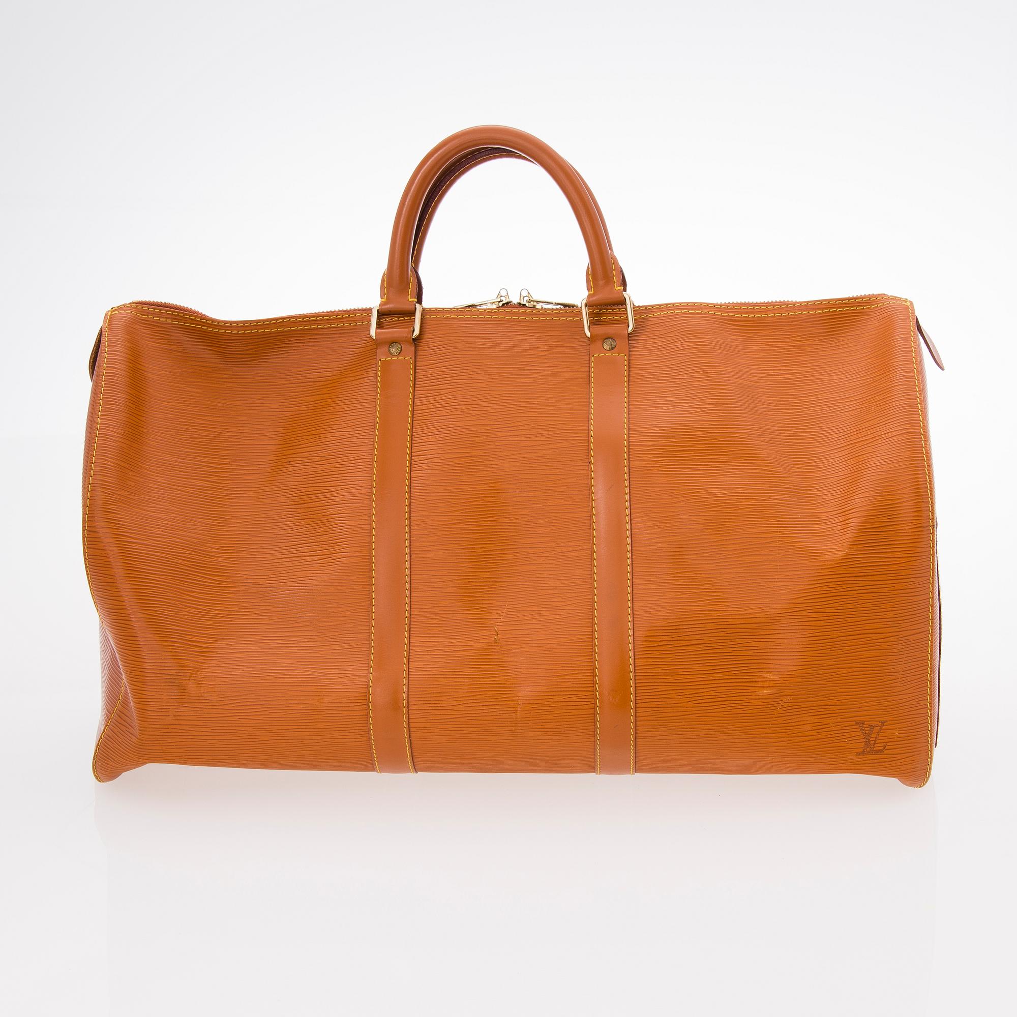 A LOUIS VUITTON CIPANGO GOLD KEEPALL 50 EPI TRAVEL BAG.