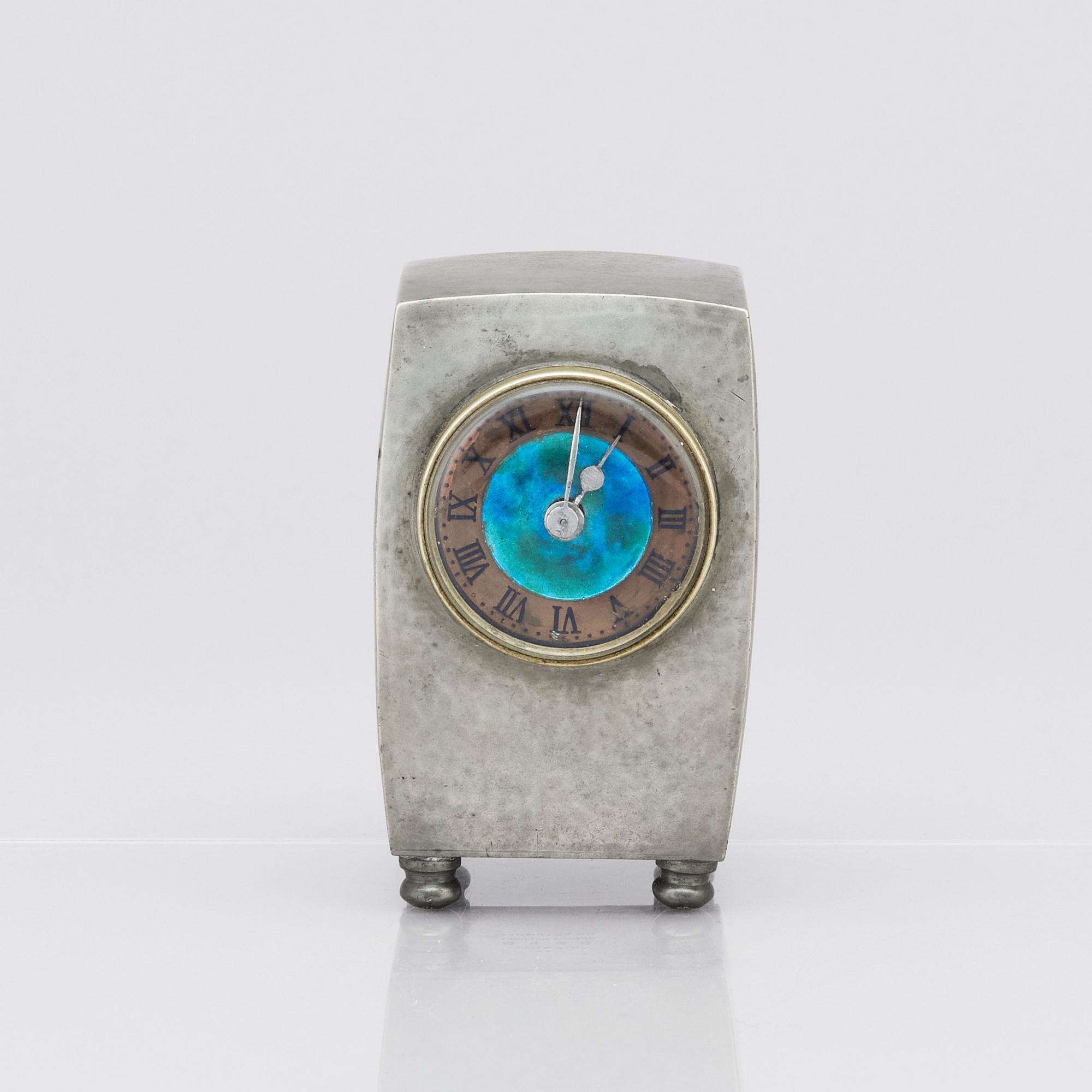 An Arts & Crafts Liberty & Co Tudric pewter and enamel timepiece, model no.0756.