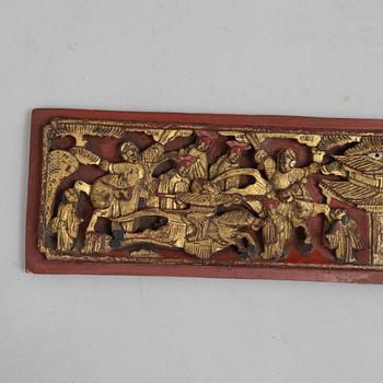 A group of three Chinese wooden panels, late Qing dynasty / around 1900.
