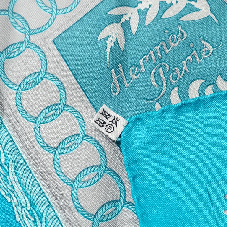 Hermès, a 'Cliquetis' silk scarf.