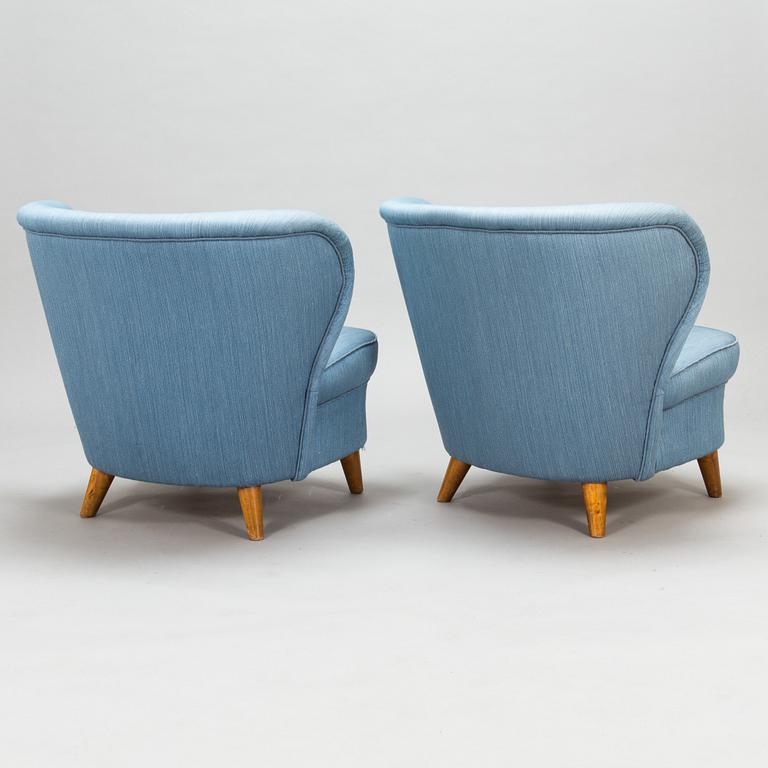 A pair of 1950's armchairs.