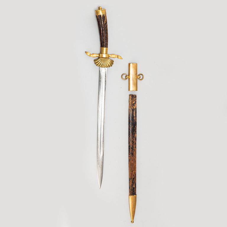 An early 20th Century hunting sword with scabbard.