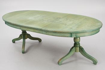 A dining table with eight chairs, Grange, France, late 20th century.