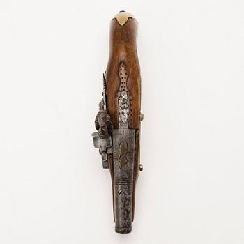 An early 19th Century flintlock pocket pistol.