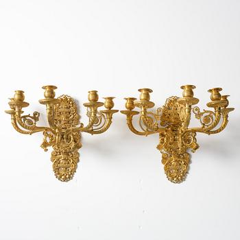 A pair of French Empire ormolu five-branch wall-lights, Paris, early 19th century.