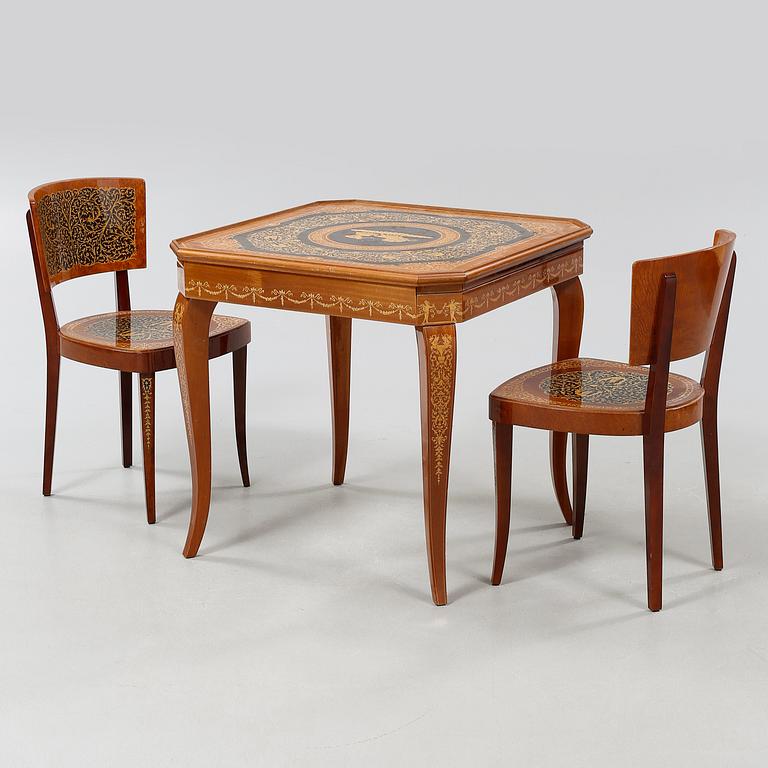 A gaming table and two chairs from Italy, 1950s.