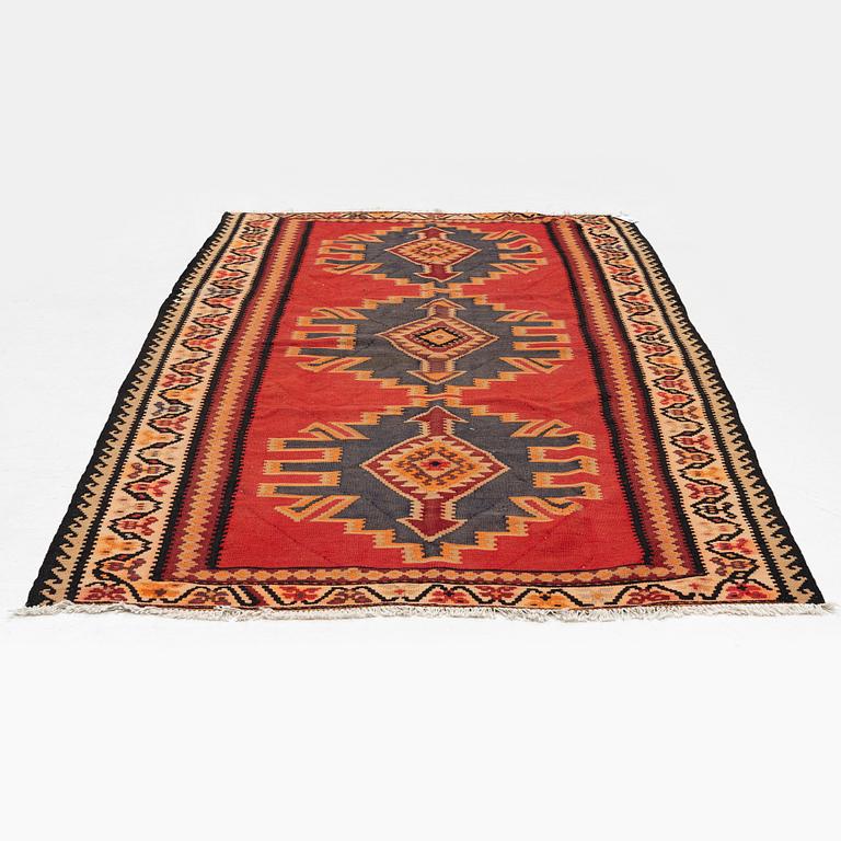 A Kilim rug, c. 300 x 165 cm.