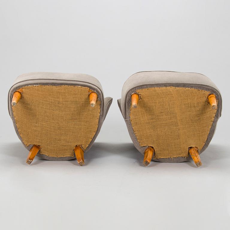 A pair of mid 20th century armchairs.