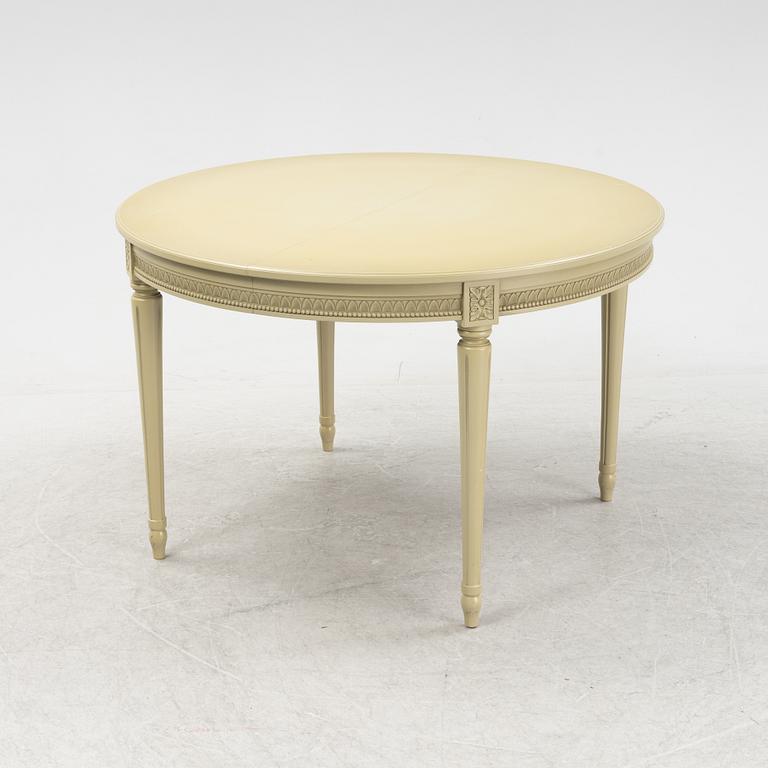 A Gustavian dining table with six chairs. Åmells dated 1974.