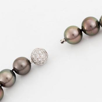 A Tahitian cultured pearl necklace with an 18K white gold clasp set with round brilliant-cut diamonds.