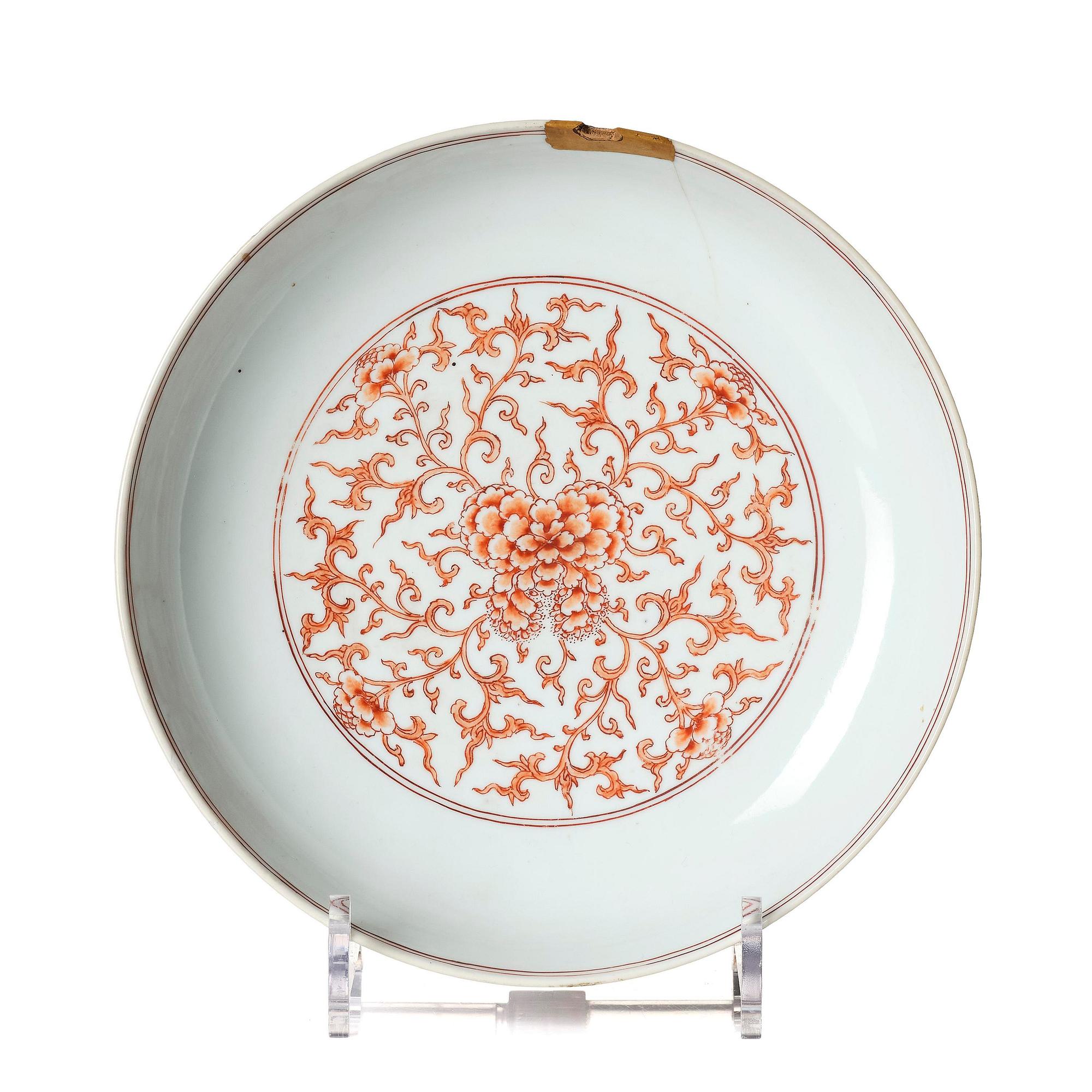 An iron red decorated 'lotus' dish, Qing dynasty, with a Kangxi six character mark and of the period (1662-1722).