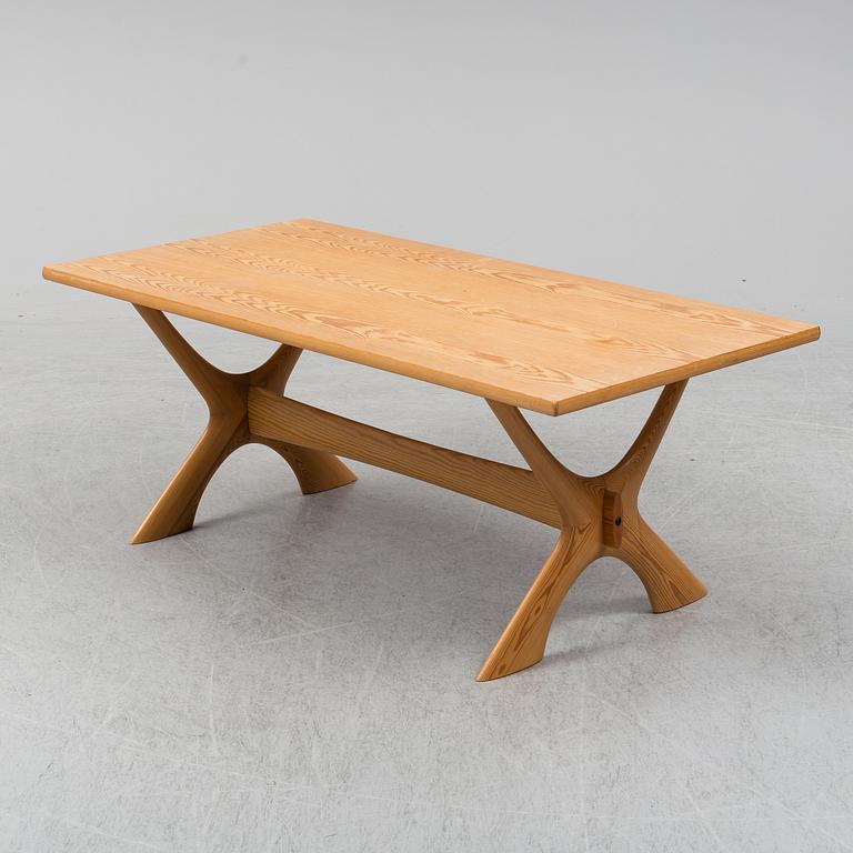 A 1960/70's pine sofa, armchair and coffee table.