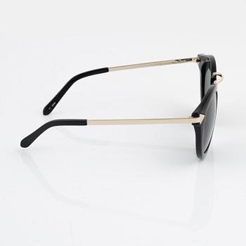 Karen Walker, a pair of "Harvest" sunglasses.