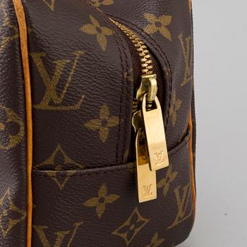 a LOUIS VUITTON ' Cite' bag.