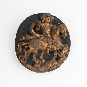 A wooden relief, "St.George and the dragon", 18th century.