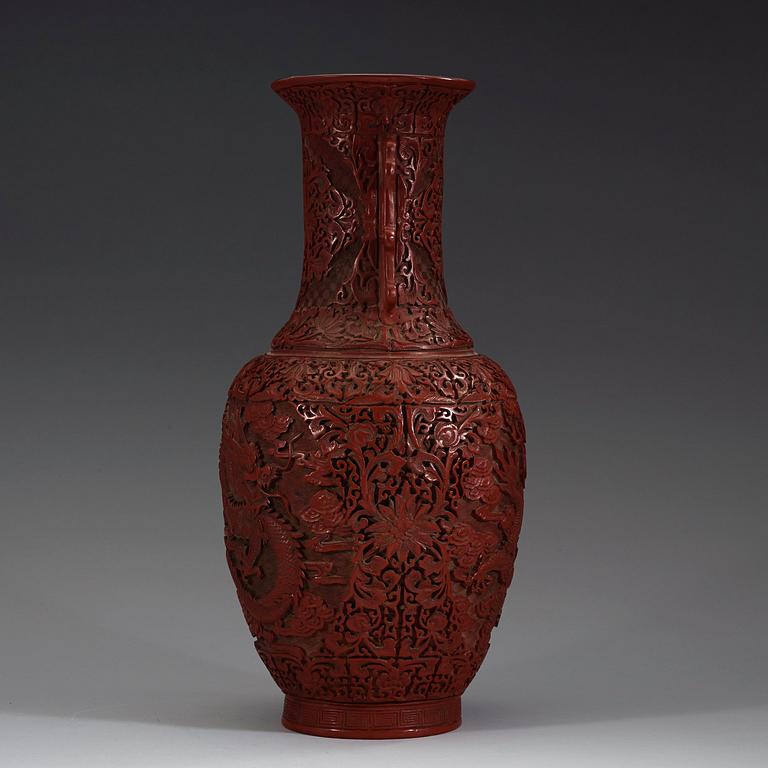 A lacquer vase, late Qing Dynasty (1644-1912) with Qianlong mark.