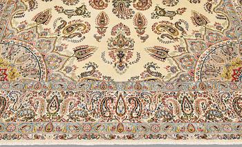 A Kirman Laver carpet, approx. 367 x 267 cm.