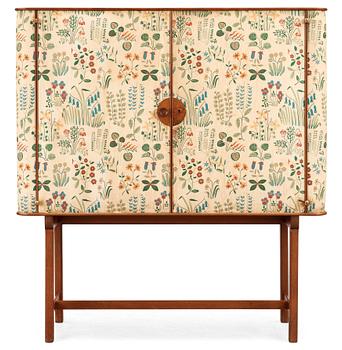 A Josef Frank mahogany cabinet, doors and sides covered in Frank's floral chintz fabric 'Fatima', Svenskt Tenn ca 1937.