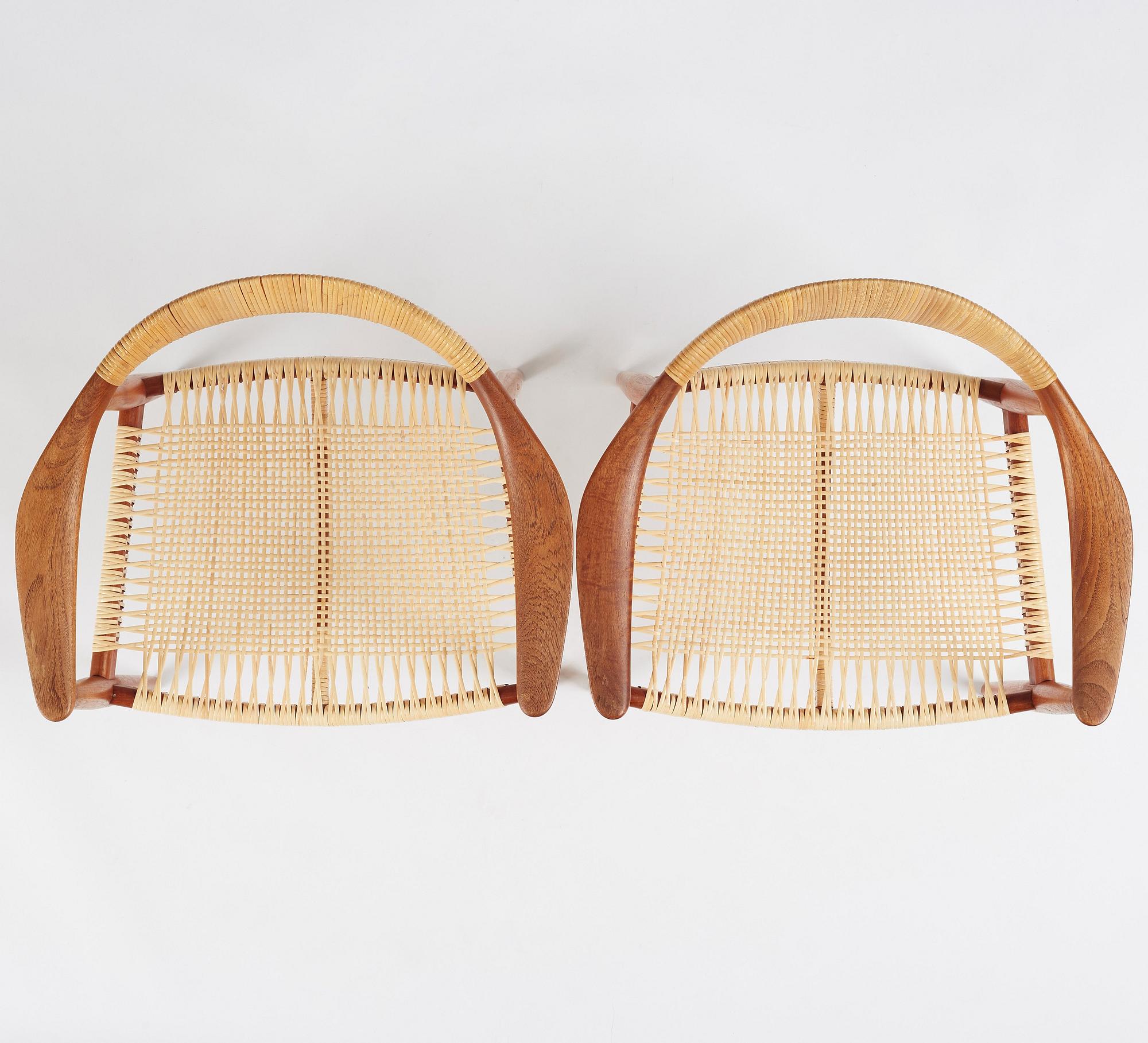 Hans J. Wegner, a pair of teak and rattan 'The Chair', JH-503, Johannes Hansen, Denmark 1950s.