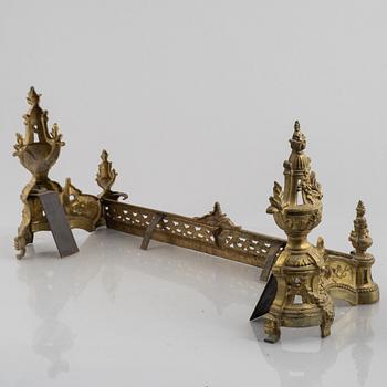 A pair of Louis XVI-style bronze andirons, France, later part of the 19th century.