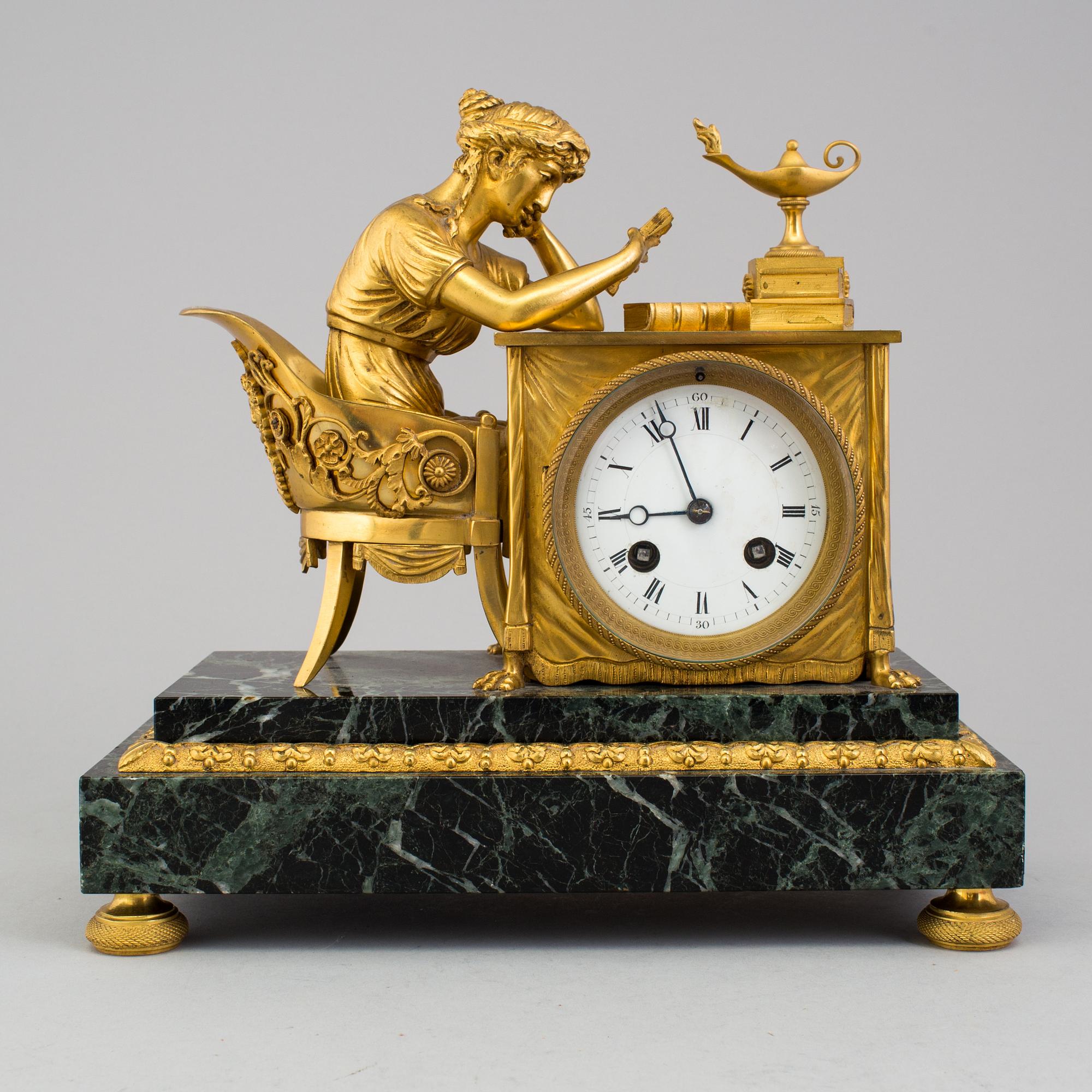 A gilt bronze Empire mantle clock, first half of the 19th Century.