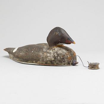 A early 20th century painted wood bird.