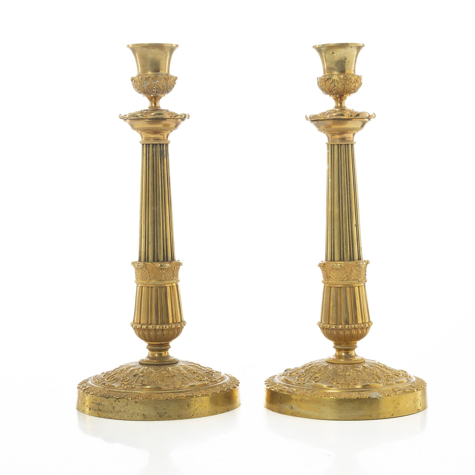A pair of French Empire candlesticks, early 19th century.