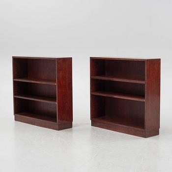 A pair of stained birch book cases.