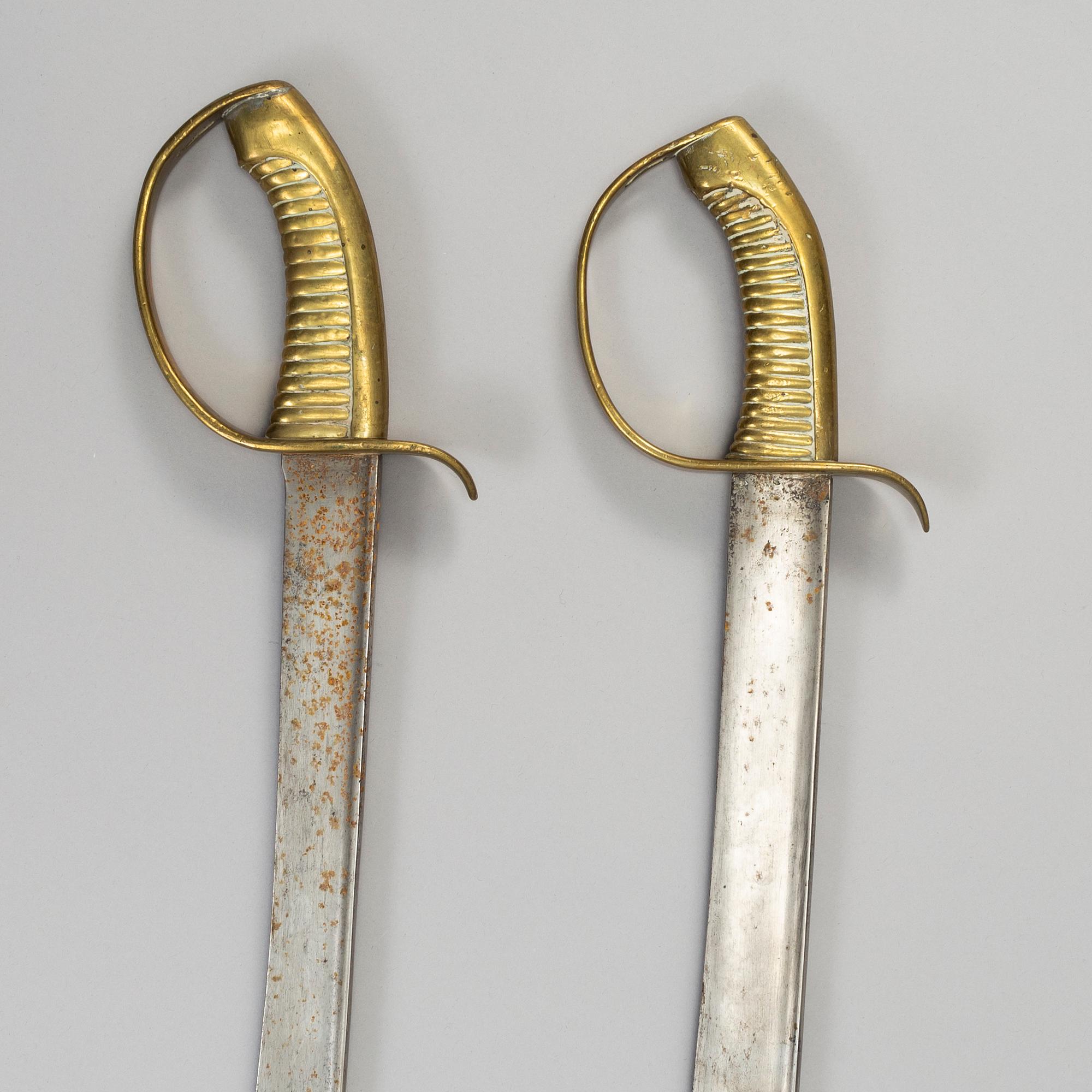 Two Swedish cutlasses 1846 pattern.