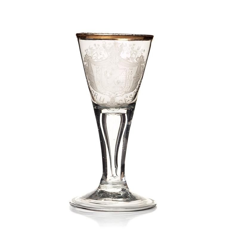 An engraved and gilded armorial wine glass, 18th Century.