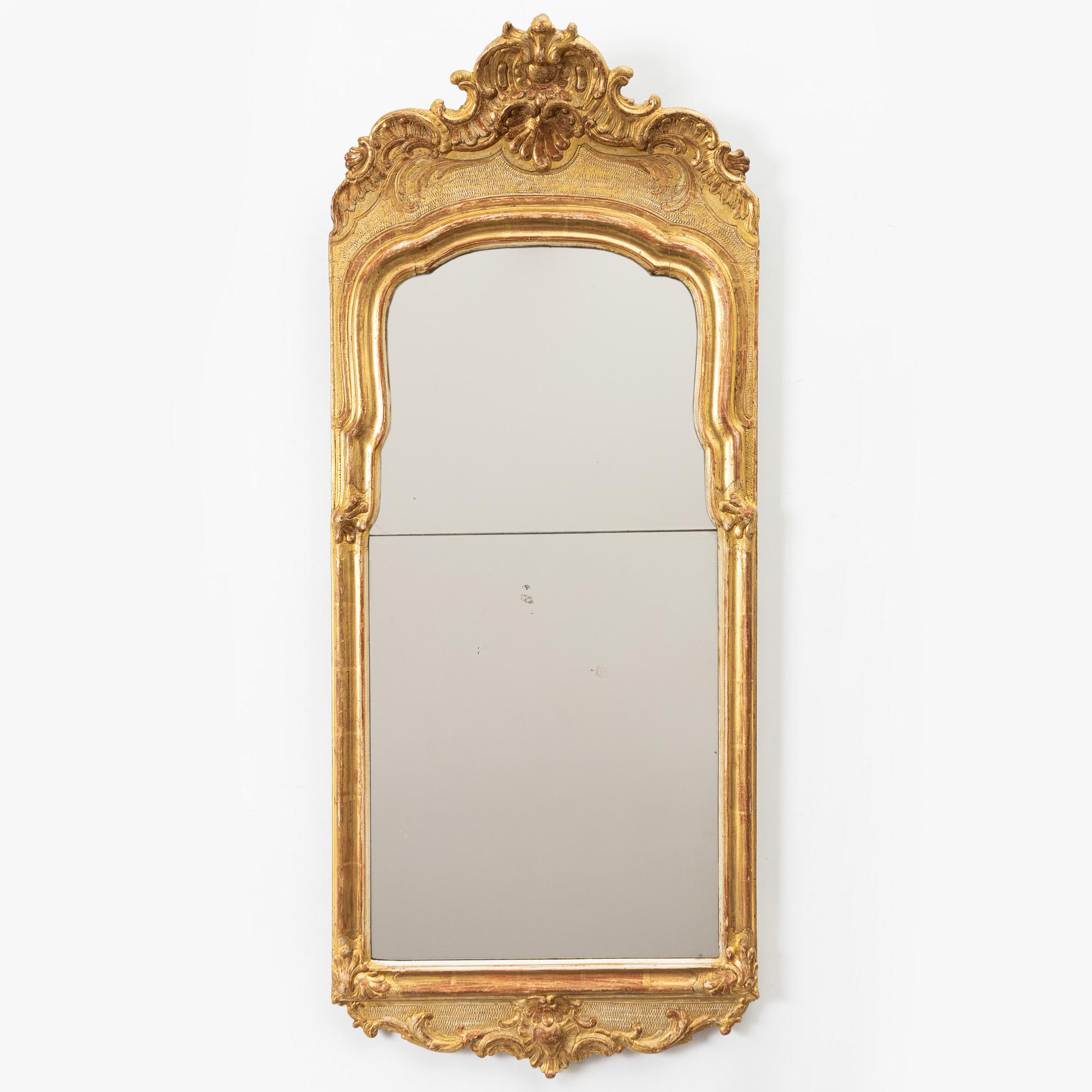 A Swedish rococo giltwood mirror, Stockholm, later part 18th century.