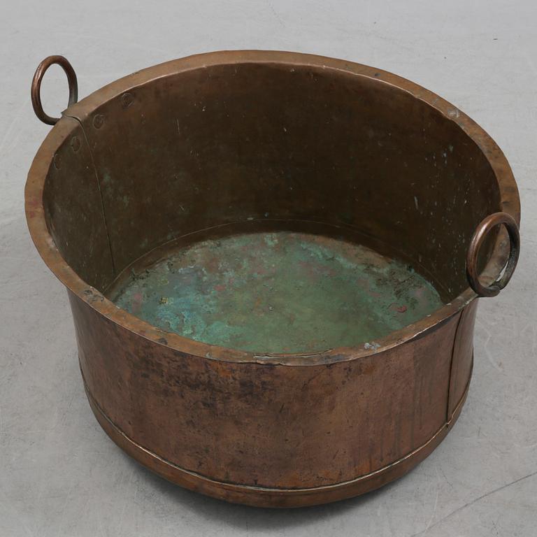 A 19th century copper cauldron.