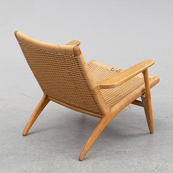 A 'CH-25' armchair designed by Hans J Wegner for Carl Hansen & Søn, Denmark.