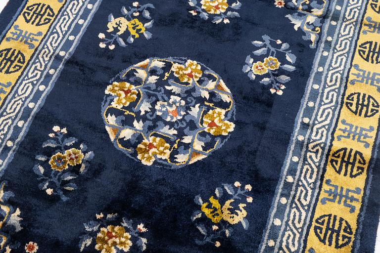 A semi-antique silk Chinaese 'Antique finish' rug, c. 175 x 122 cm.