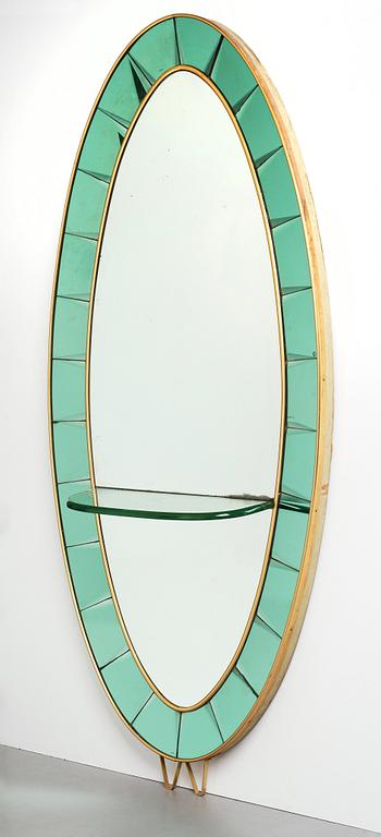 Italian designer, a wall mirror, 1950-60's. Emerald green tinted glass and brass frame.