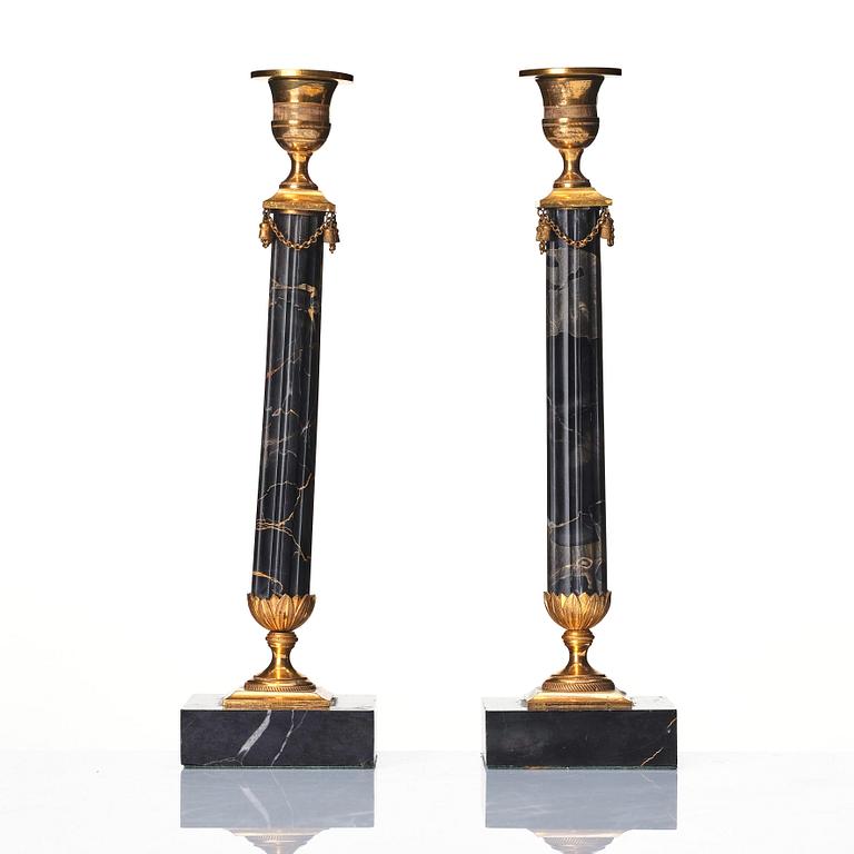 A pair of late Gustavian Portor marble candlesticks, late 18th century.