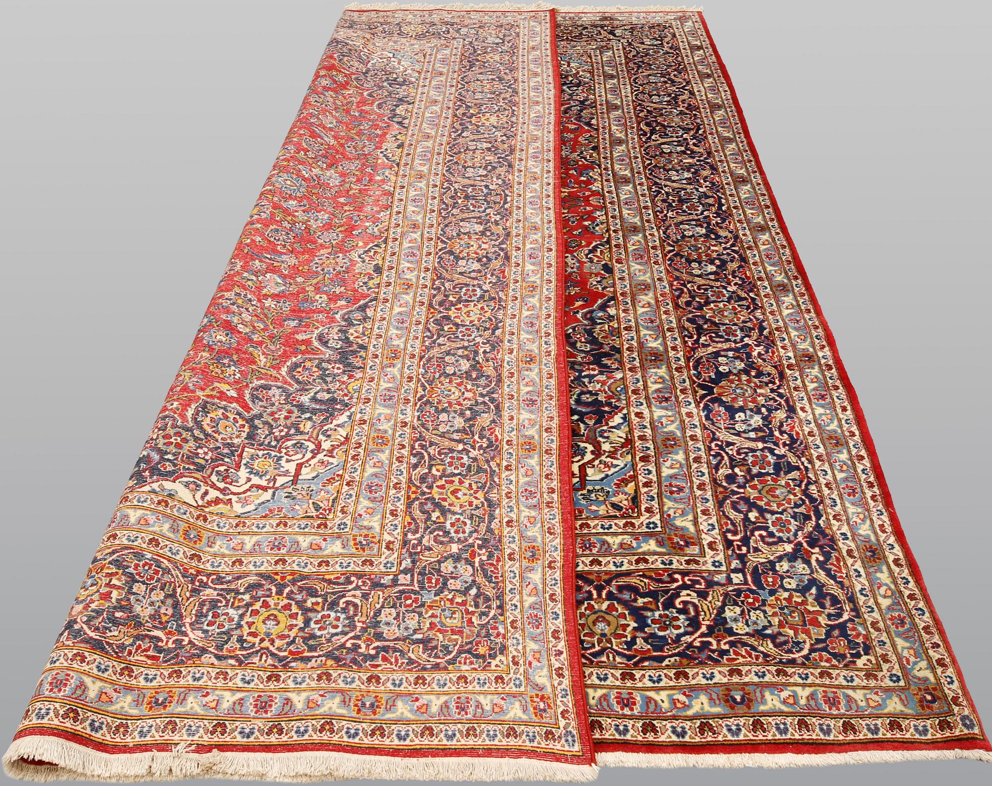 A Keshan carpet, approx. 307 x 200 cm.