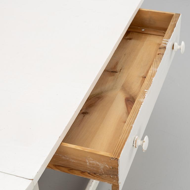 An early 20th century drop-leaf table.