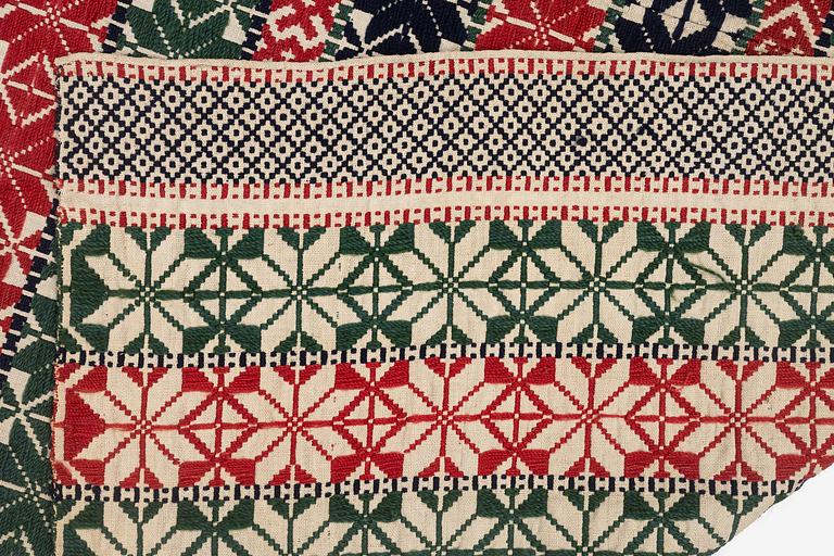 A bed cover in weft-patterned tabby type, c. 180 x 126, Scania, Sweden, first half of the 19th century.