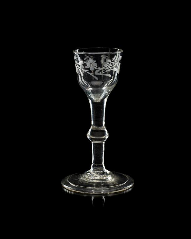 An engraved wine glass, 18th Century, presumably England.