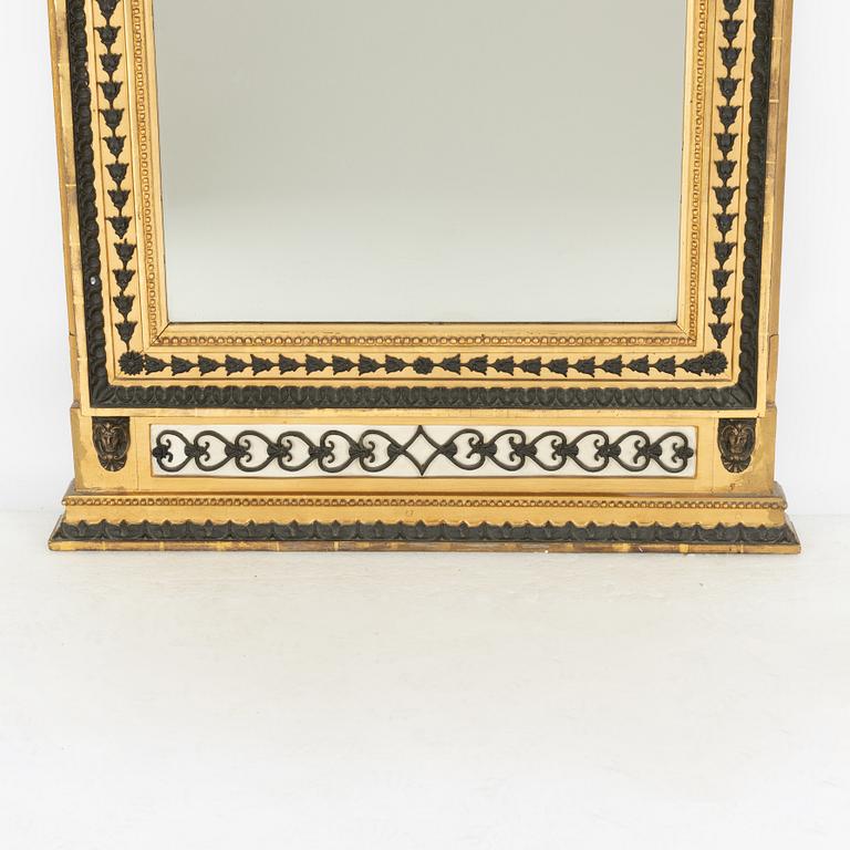 A Swedish Empire giltwood and bronzed mirror attributed to Jonas Frisk (master in Stockholm 1805-24).