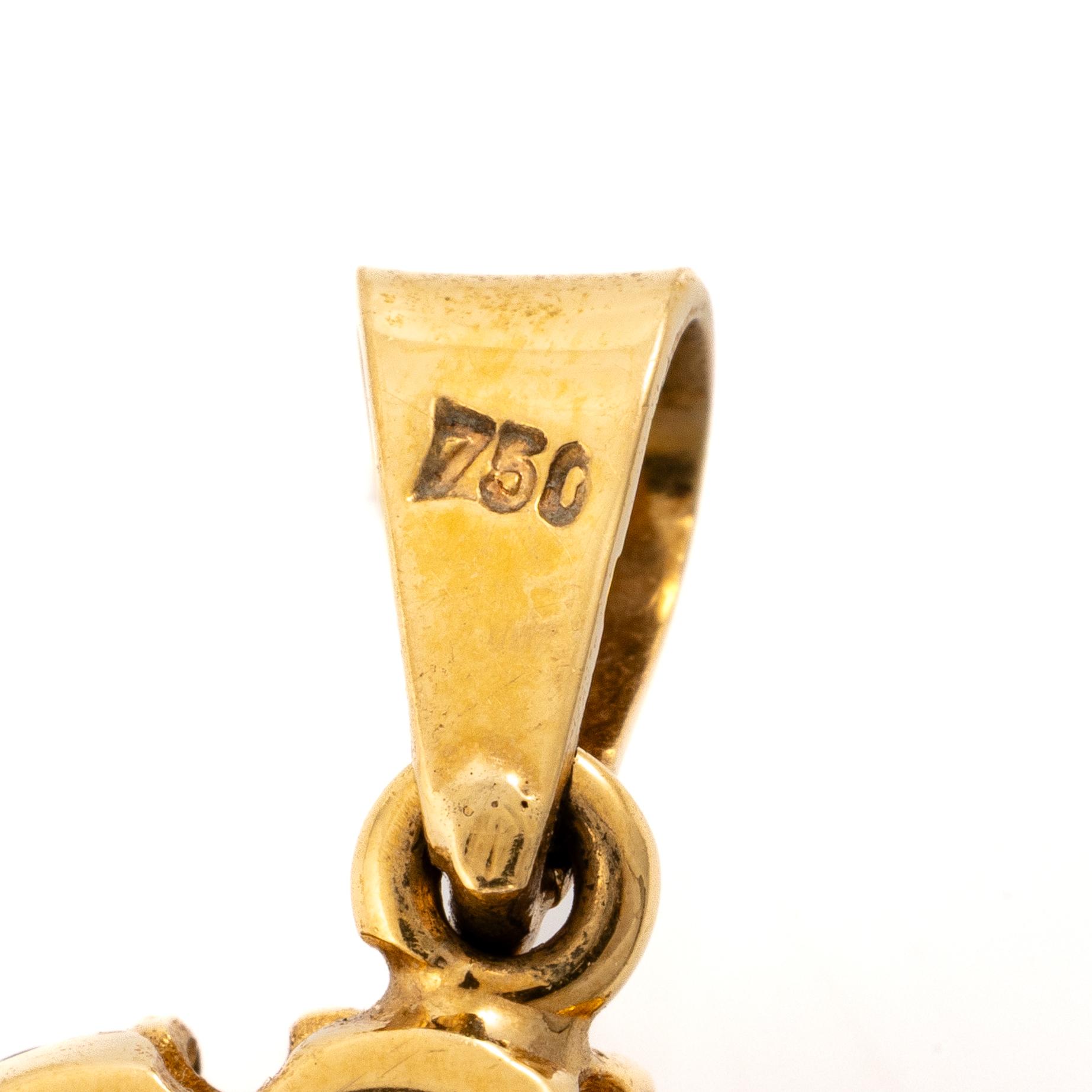Pendant, 18K gold with garnets.